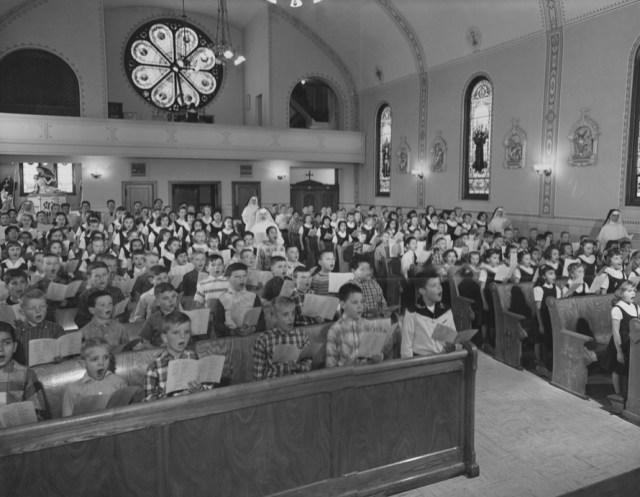 Holy Rosary students singing in the church - many years ago